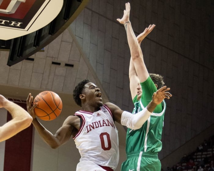 Indiana guard Xavier Johnson (0) shoots the ball while Marshall forward Mikel Beyers (31) defends during the Hoosiers' 90-79 win over Marshall. (Trevor Ruszkowski/USA TODAY Sports)
